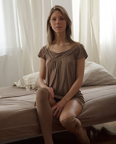 Anjelica has brown stockings on