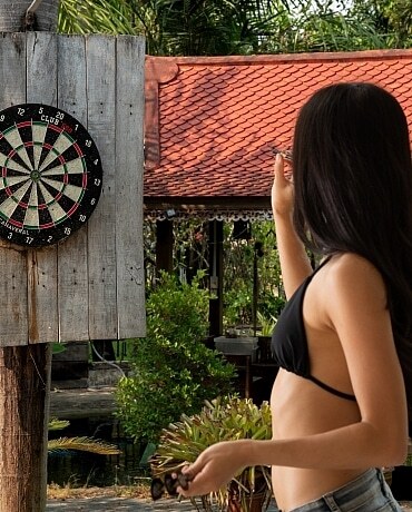Mayuko plays darts naked outdoors 