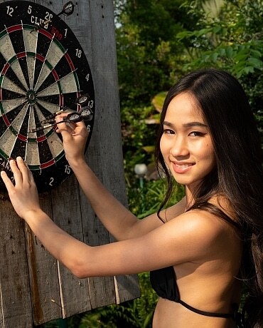 Mayuko plays darts naked outdoors 